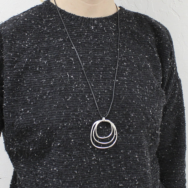 Large Tiered Hammered Rings on Black Cord Necklace