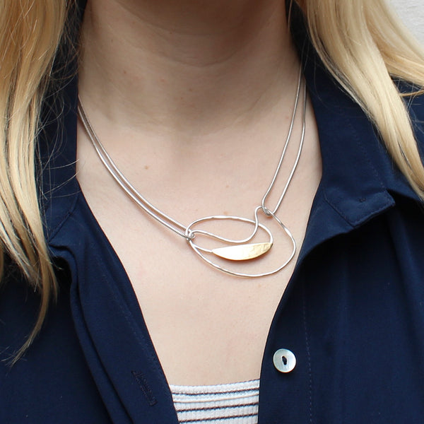 Oval Ring with Slice and Swoosh on Doubled Chain Necklace