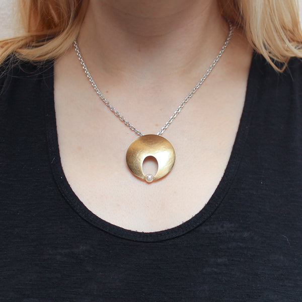 Cutout Disc with Cream Pearl Necklace
