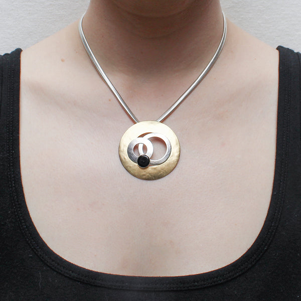 Large Cutout Disc with Layered Rings and Black Cabochon on Wide Snake Chain Necklace